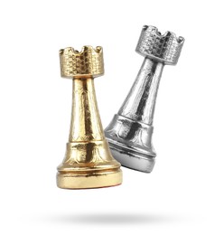 Image of Golden and silver chess rooks in air on white background