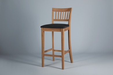 Photo of Stylish bar stool on light grey background. Interior element