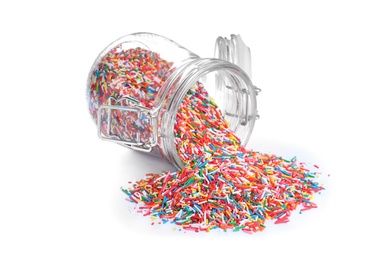 Photo of Colorful sprinkles and glass jar on white background. Confectionery decor