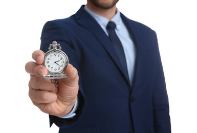 Businessman holding pocket watch on white background, closeup. Time management