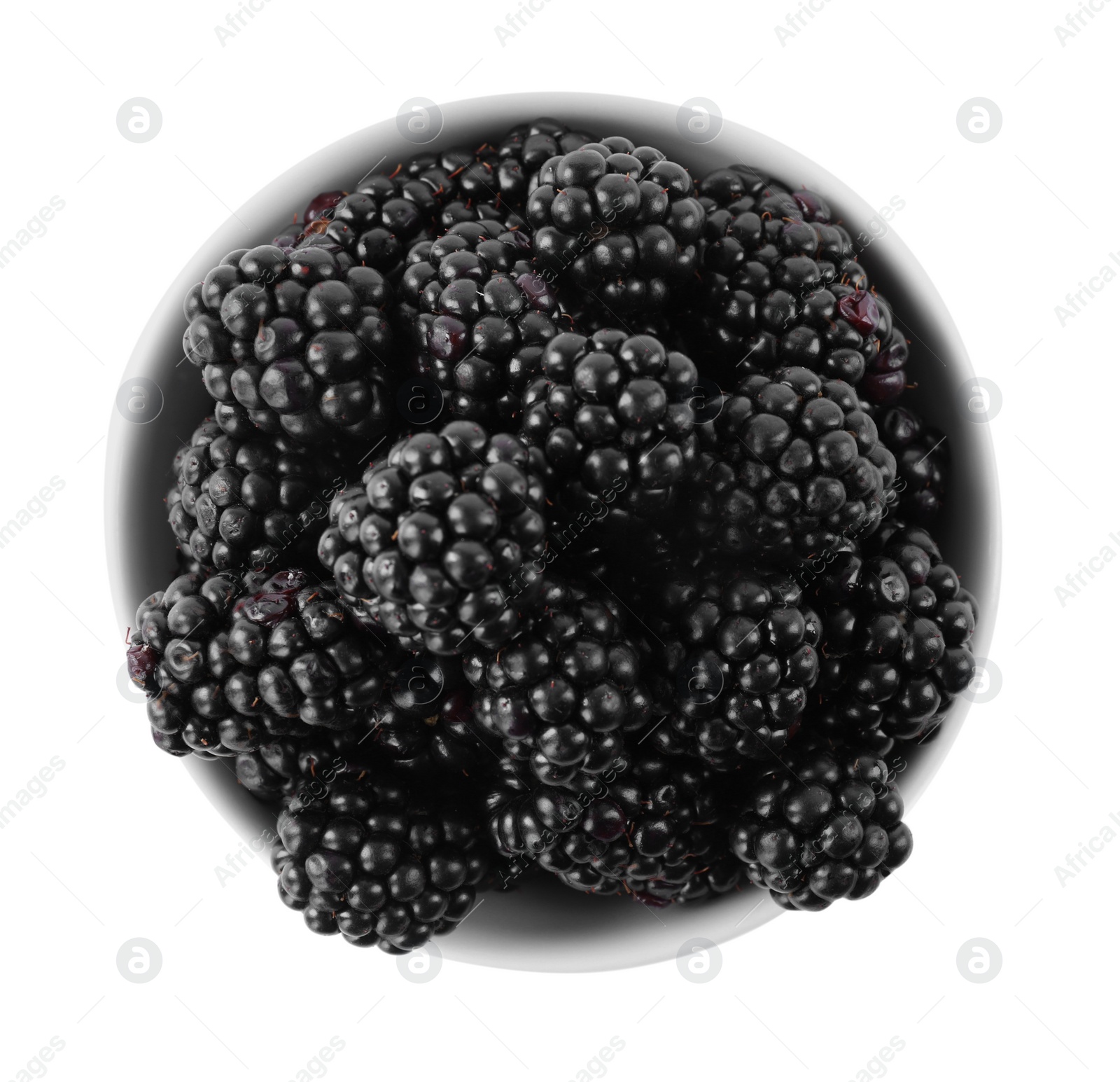 Photo of Fresh ripe blackberries in bowl isolated on white, top view