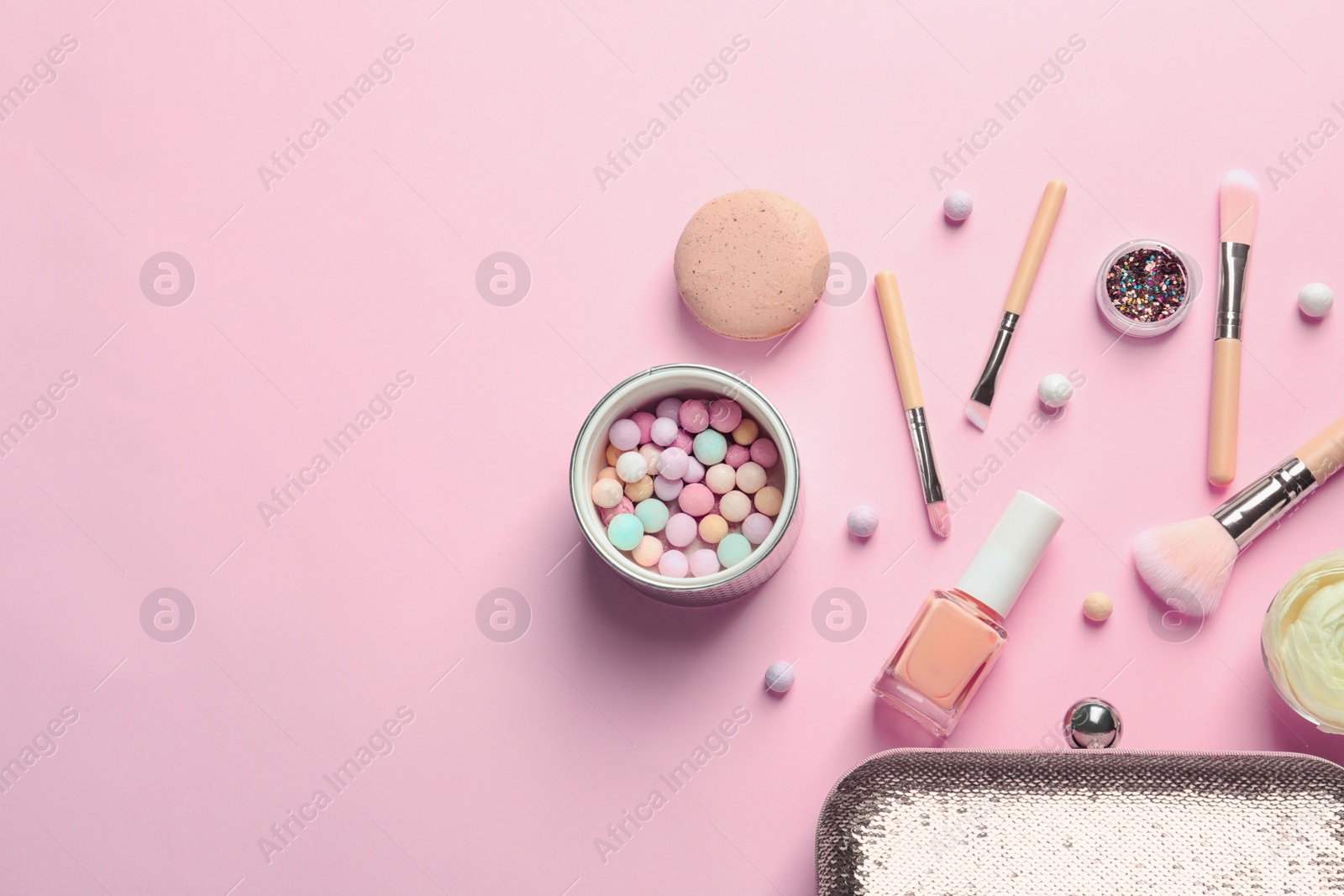 Photo of Makeup products with cosmetic bag on color background