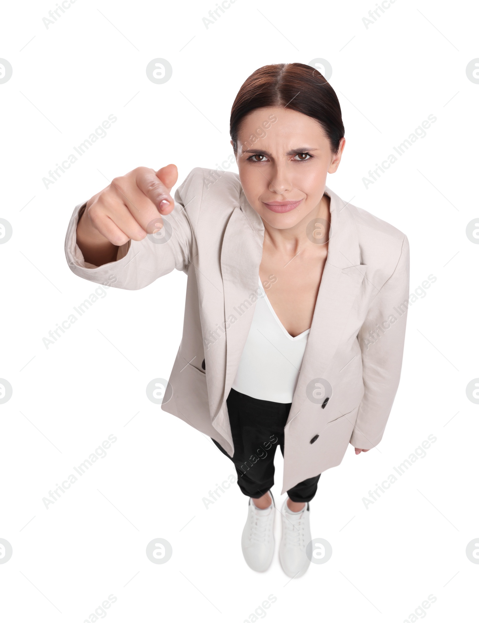 Photo of Beautiful businesswoman in suit pointing at something on white background, above view