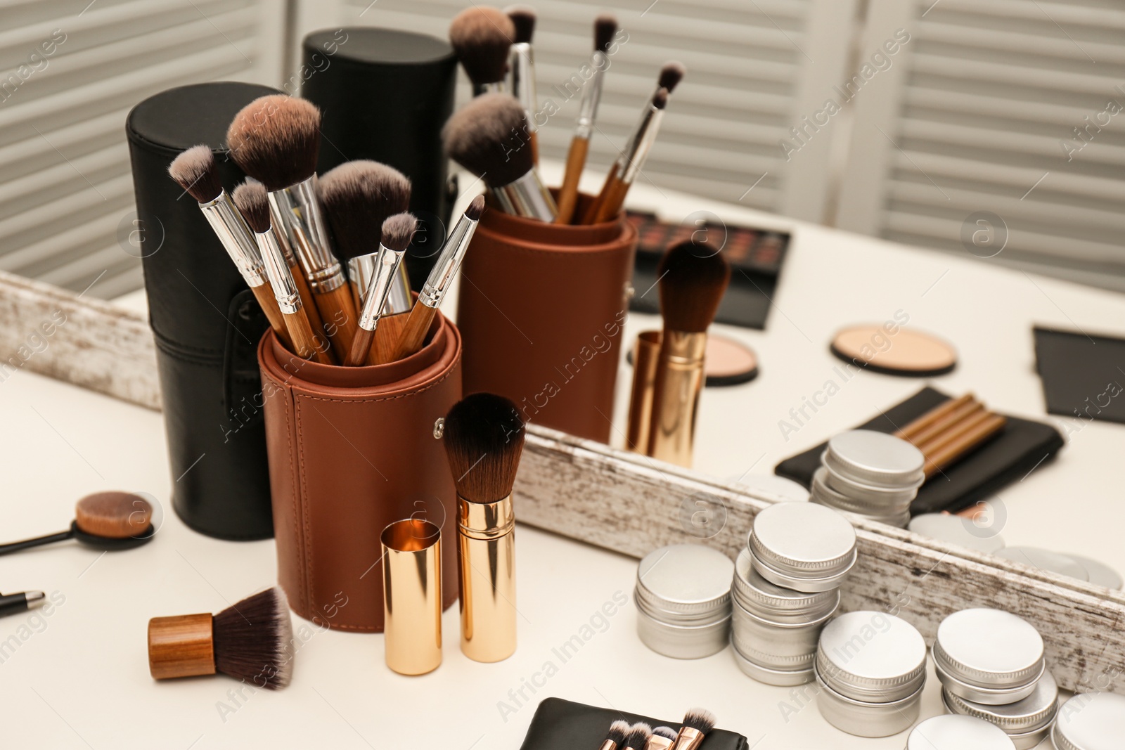 Photo of Professional makeup artists workplace with tools and cosmetic