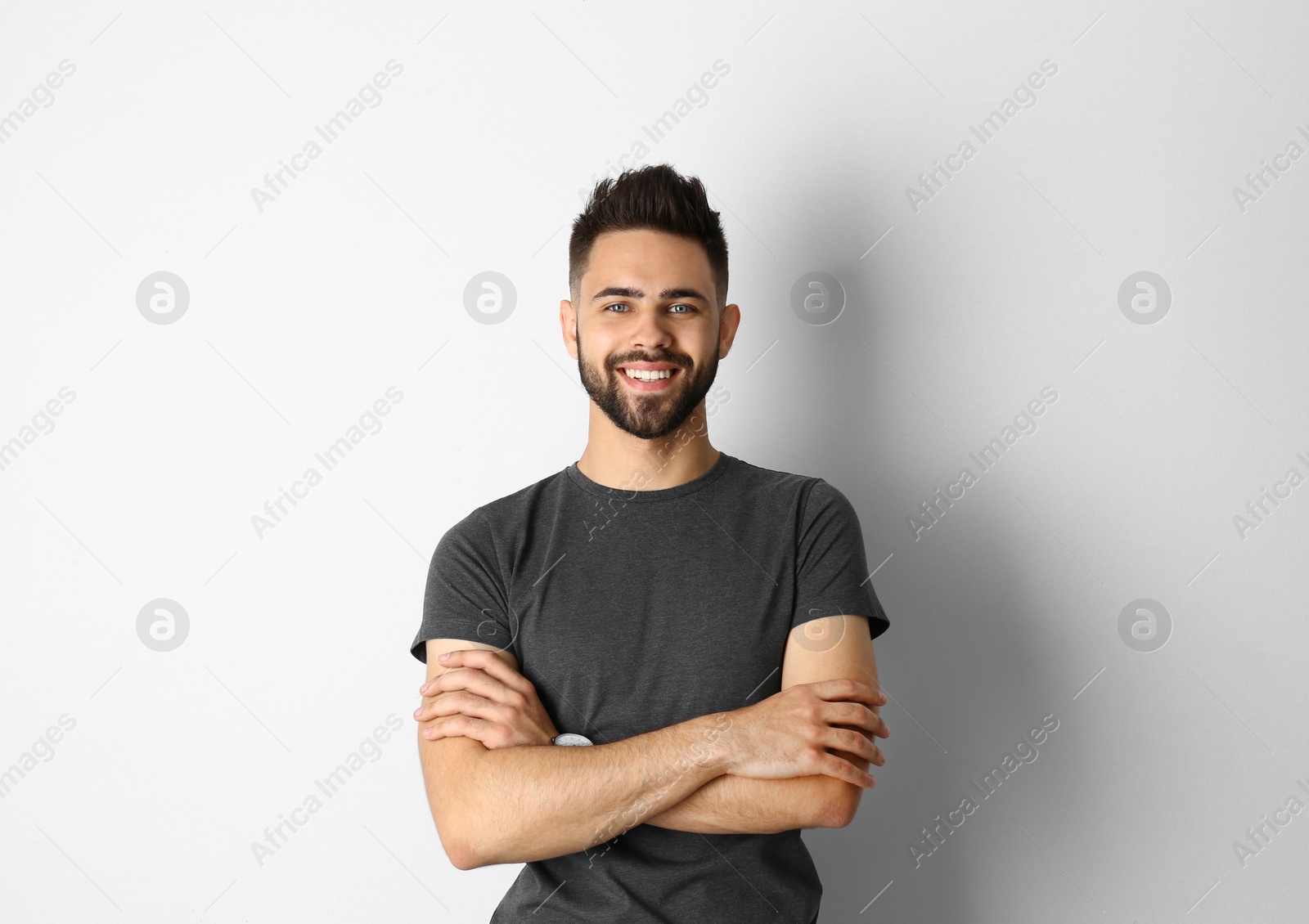 Photo of Portrait of handsome smiling man isolated on white