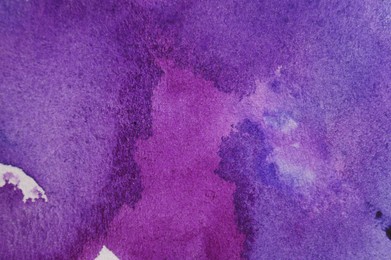 Photo of Abstract purple watercolor painting as background, top view