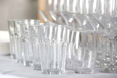 Photo of Set of empty glasses on table indoors