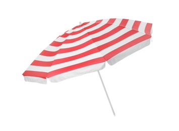 Photo of Open red striped beach umbrella isolated on white