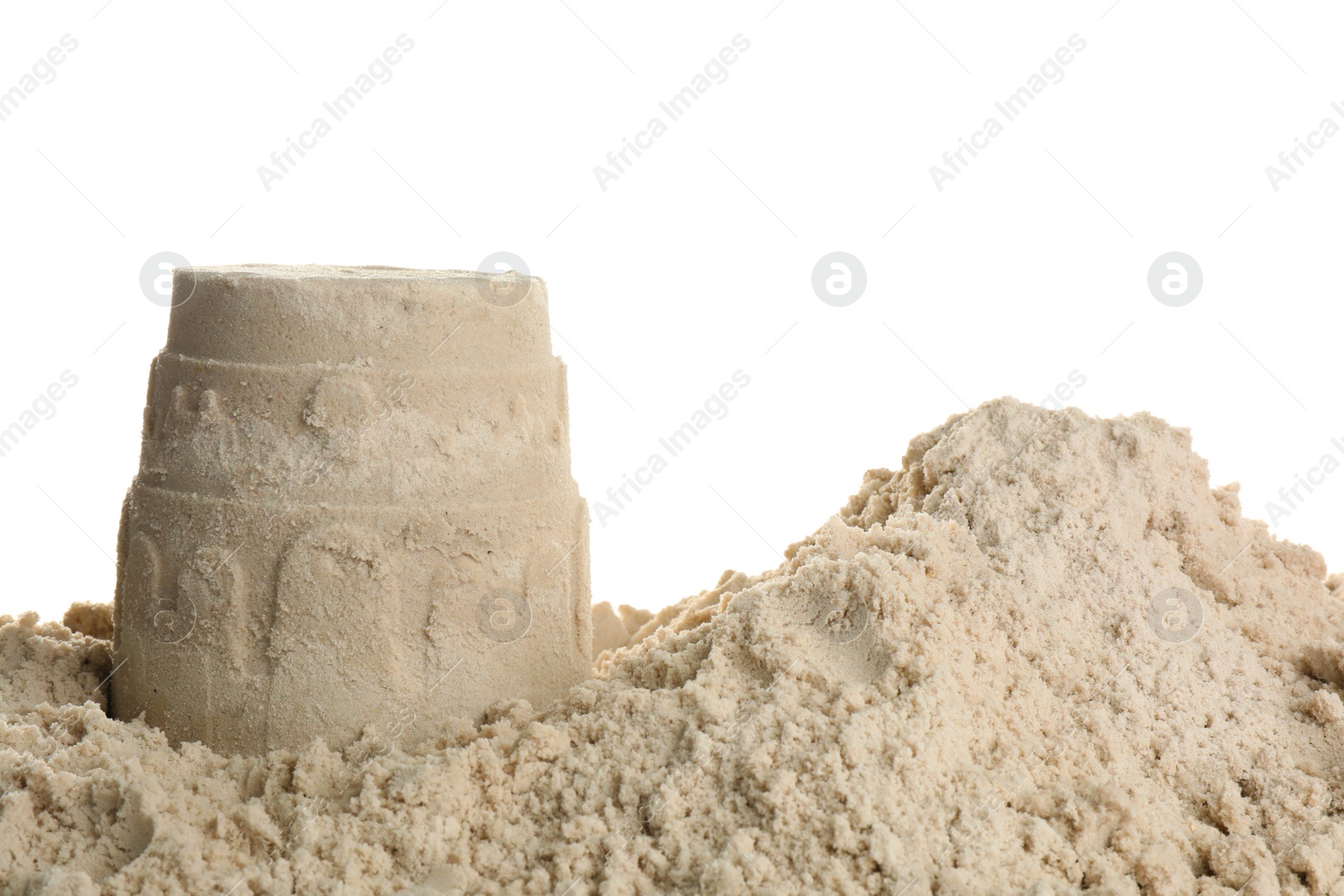 Photo of Pile of sand with castle on white background. Outdoor play