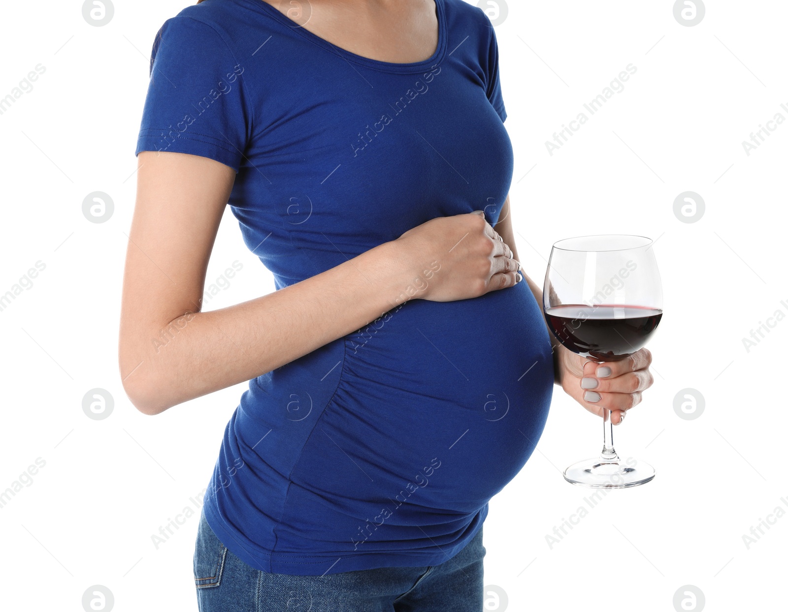 Photo of Future mother with glass of wine on white background, closeup. Alcohol abuse during pregnancy