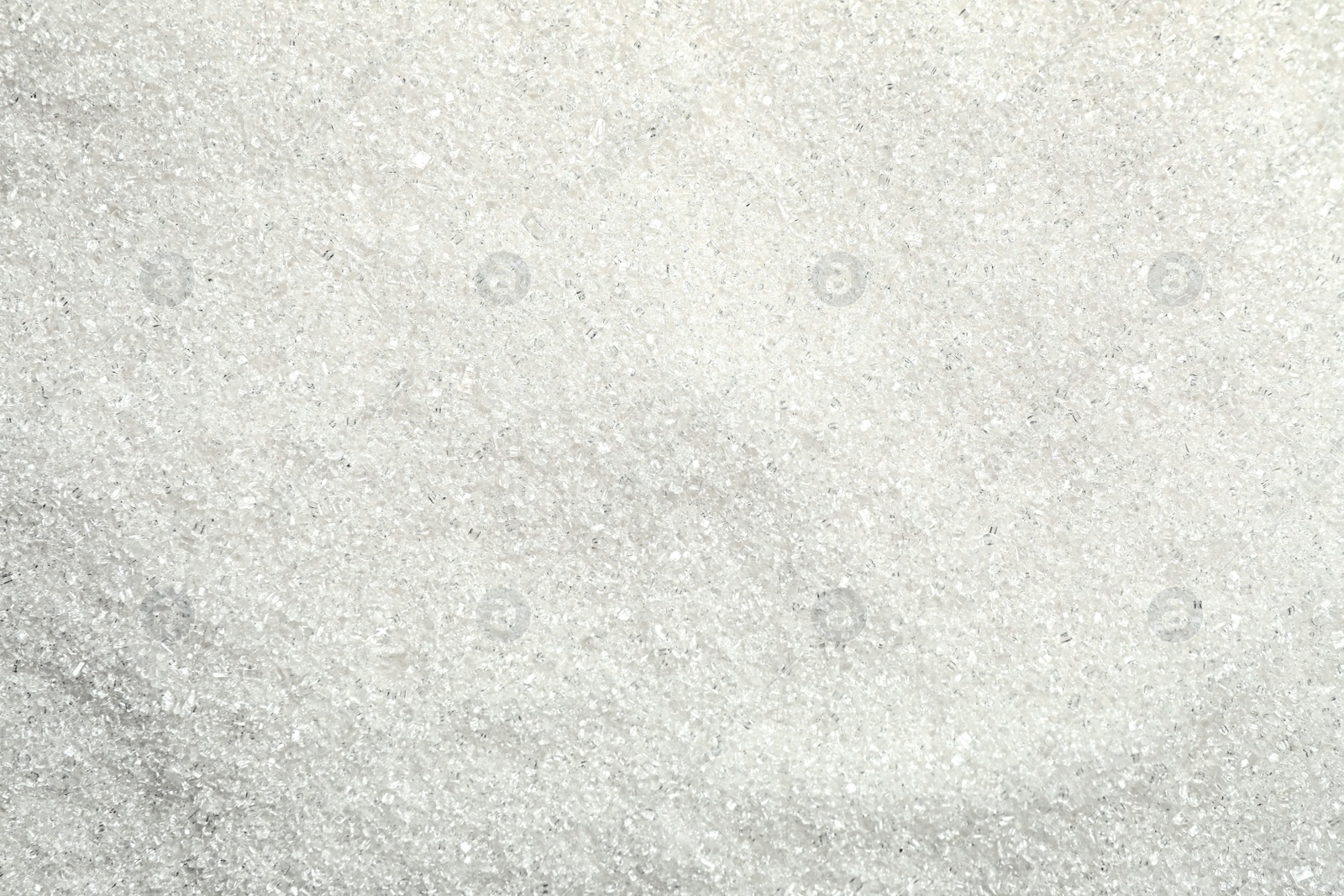 Photo of Pile of granulated sugar as background, top view
