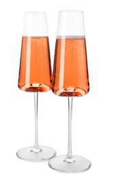 Glasses of rose champagne isolated on white