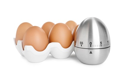 Photo of Kitchen timer and chicken eggs on white background