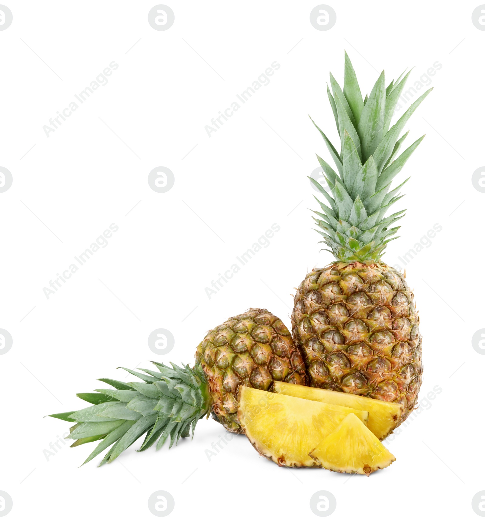 Photo of Whole and cut tasty ripe pineapples isolated on white