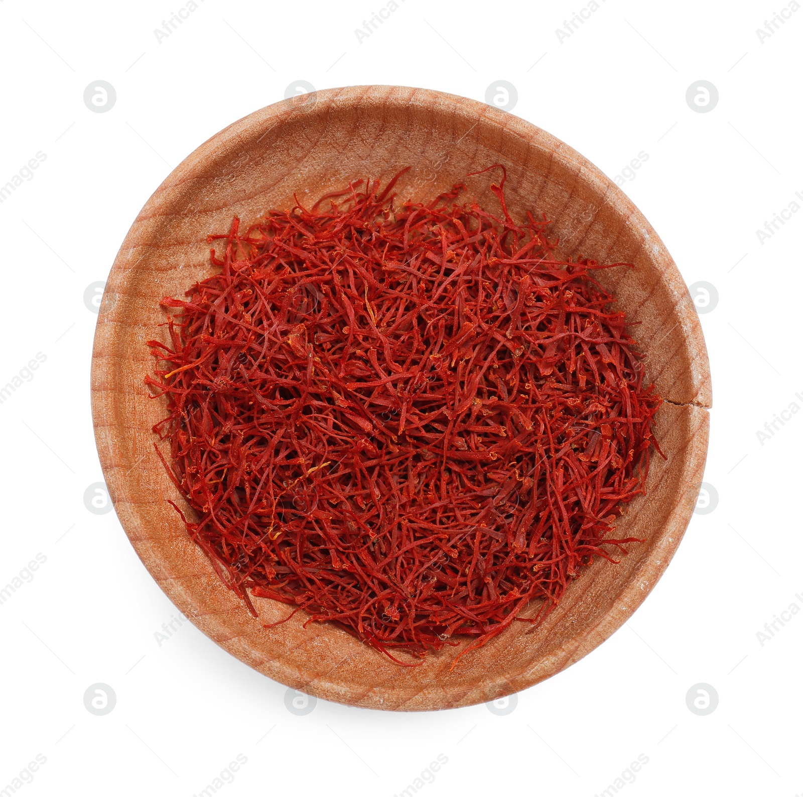 Photo of Aromatic saffron in bowl isolated on white, top view