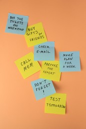 Photo of Many different reminder notes on pale orange background
