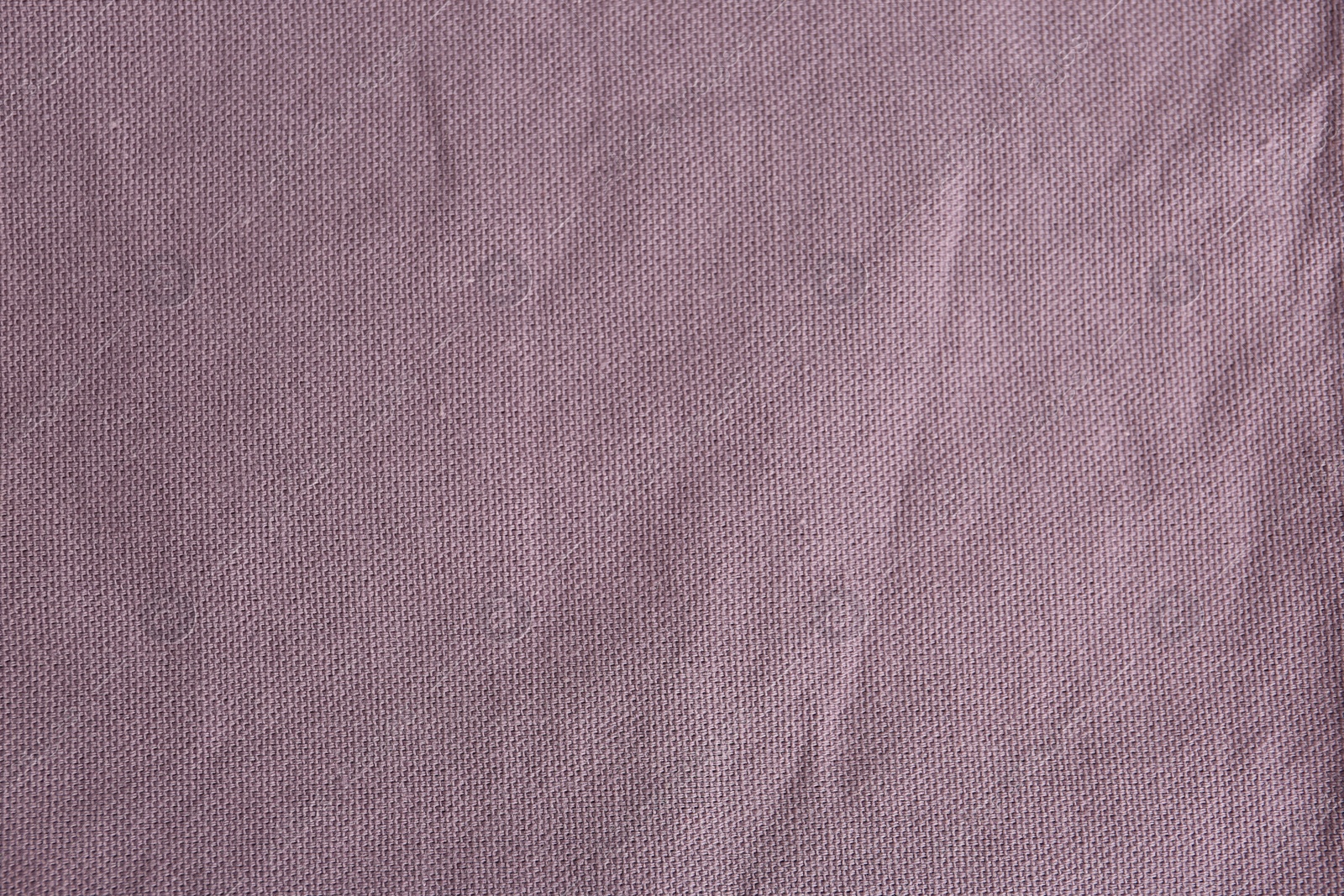 Photo of Texture of beautiful light purple fabric as background, closeup