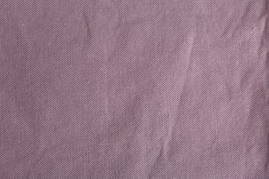 Texture of beautiful light purple fabric as background, closeup