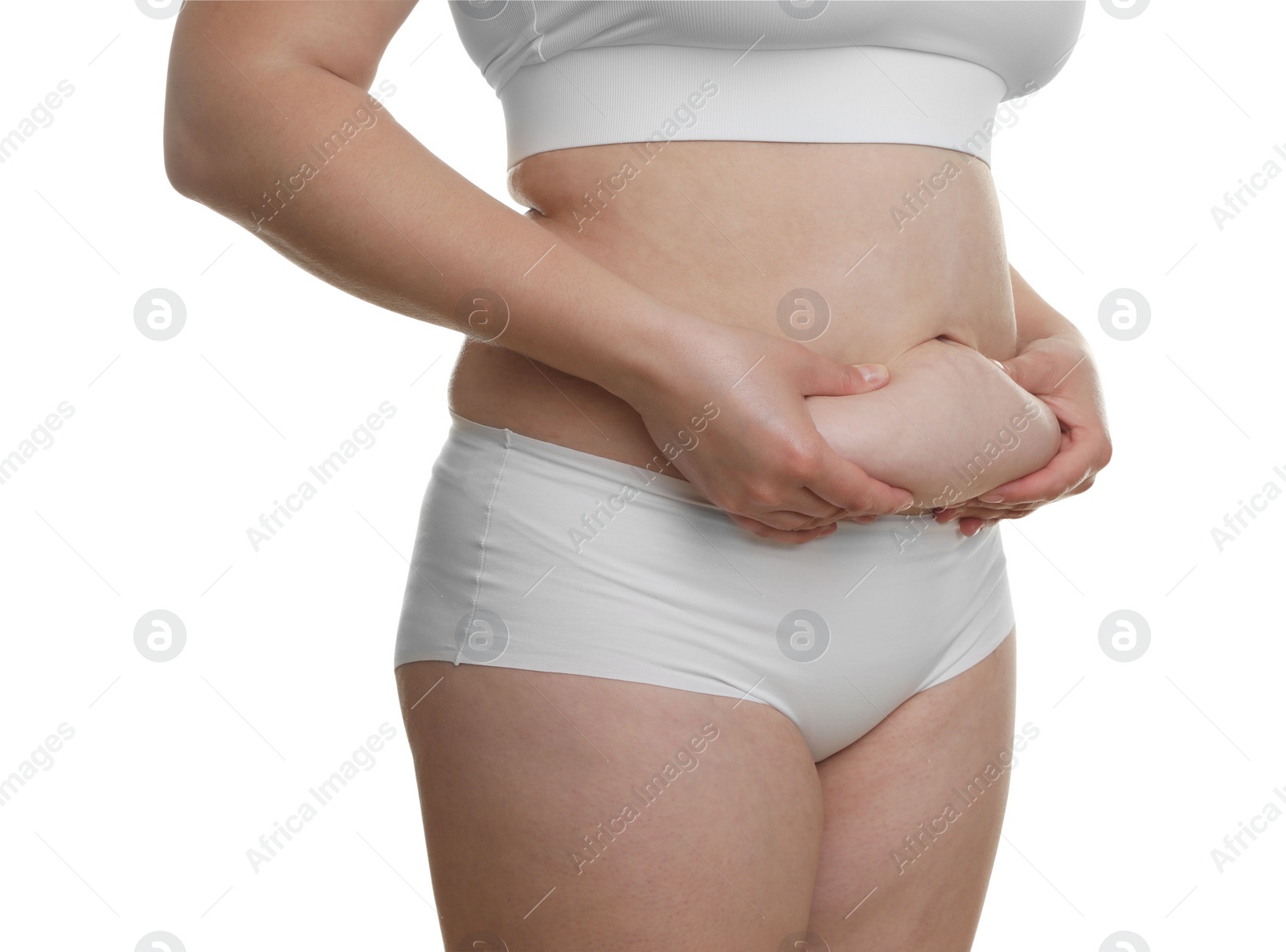 Photo of Woman touching belly fat on white background, closeup. Overweight problem