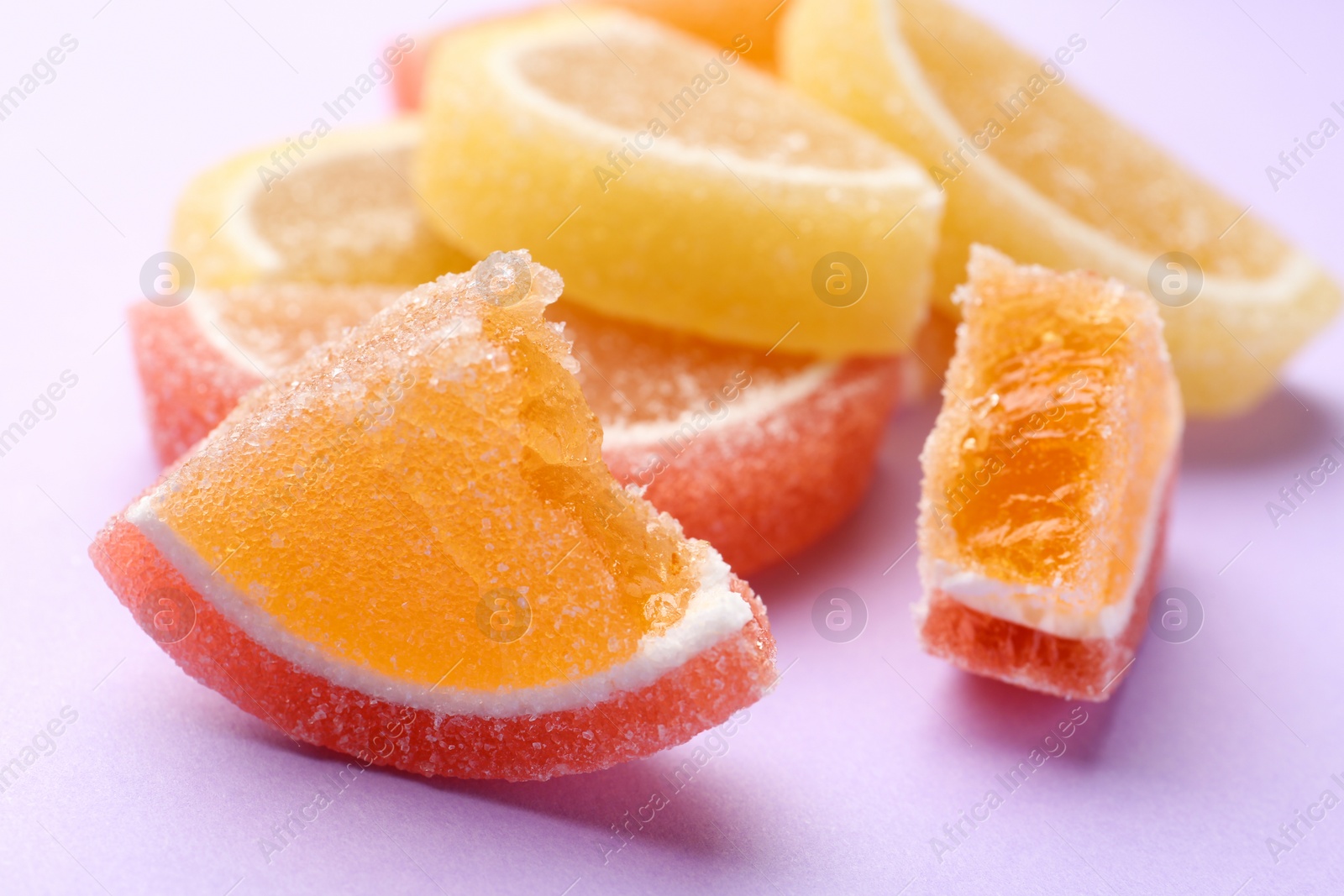 Photo of Tasty bright jelly candies on color background