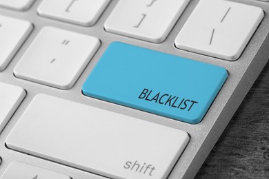 Light blue button with word Blacklist on computer keyboard, closeup