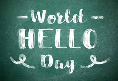 Phrase World Hello Day written on green chalkboard