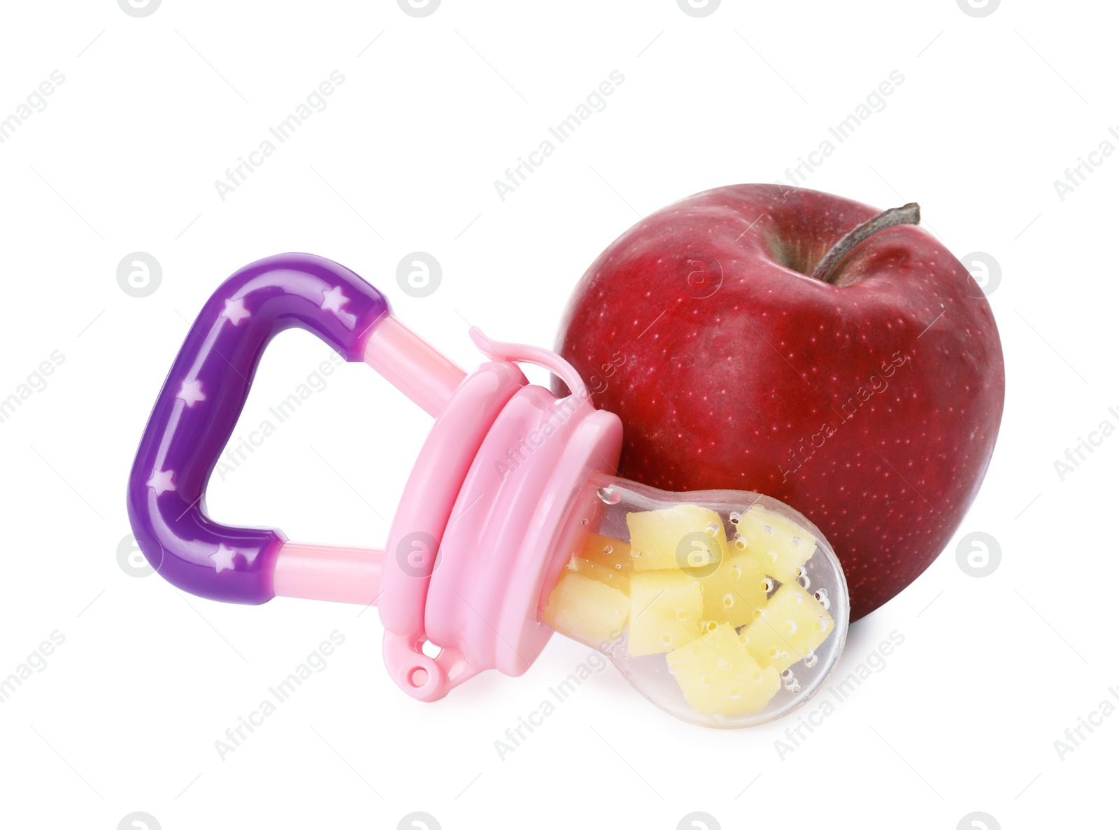 Photo of Nibbler with fresh apple on white background. Baby feeder