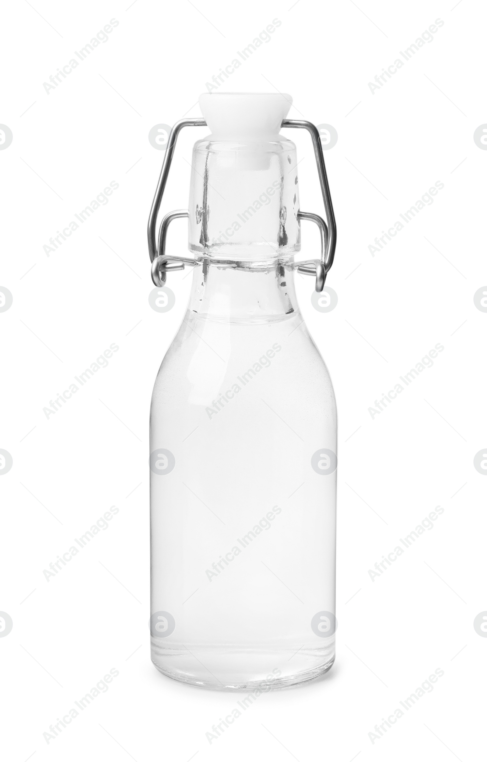 Photo of Vinegar in glass bottle isolated on white