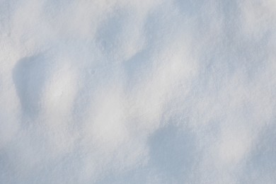 Photo of White snow as background, top view. Winter season