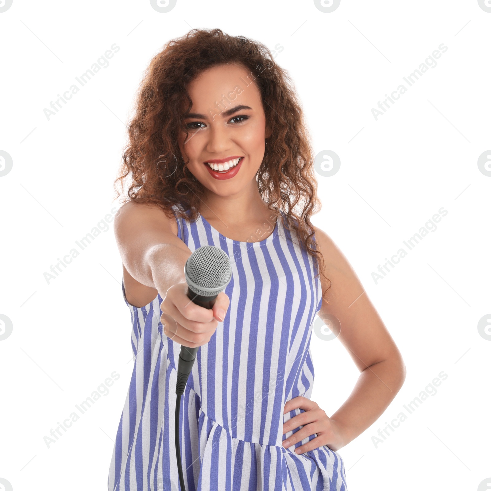 Photo of Curly African-American woman in casual clothes with microphone on white background