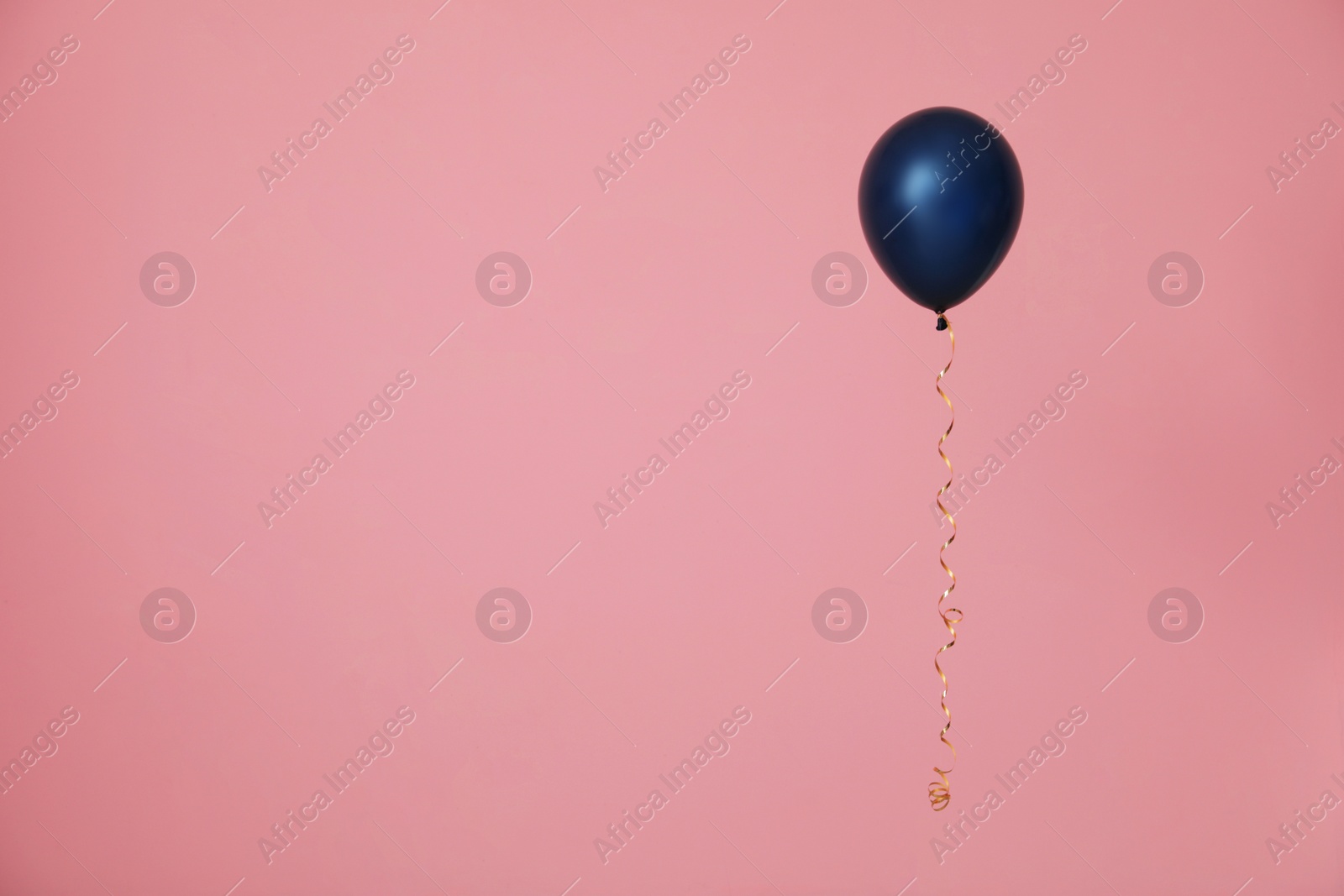 Photo of Bright balloon on color background, space for text. Celebration time