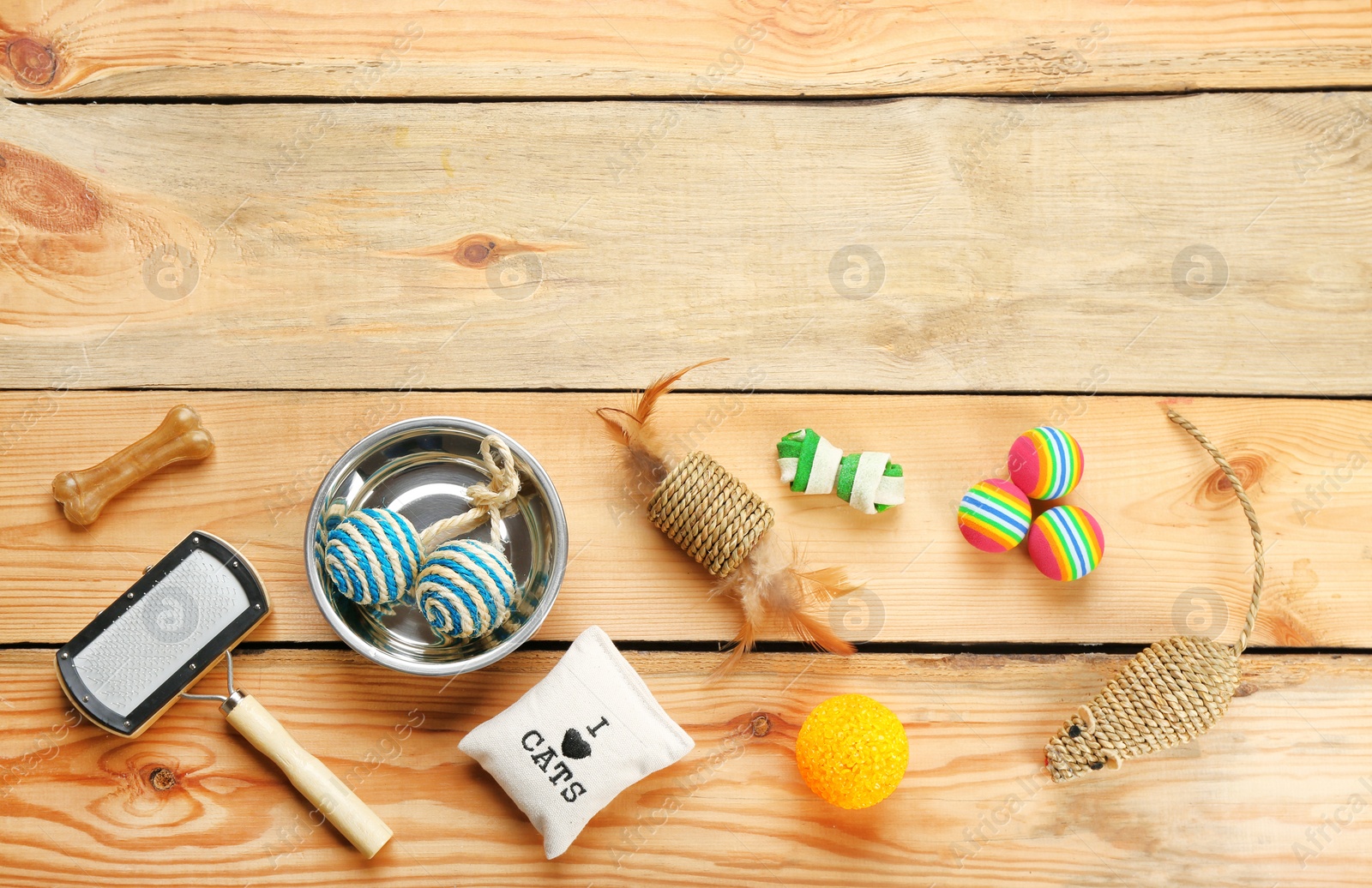 Photo of Flat lay composition with cat accessories on wooden background