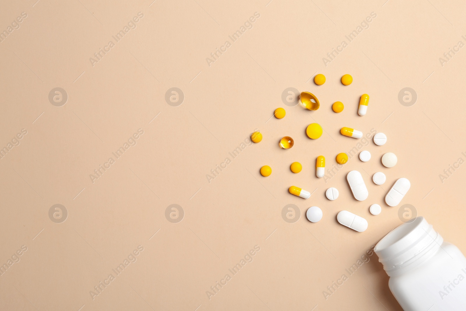 Photo of Flat lay composition with bottle, pills and space for text on color background