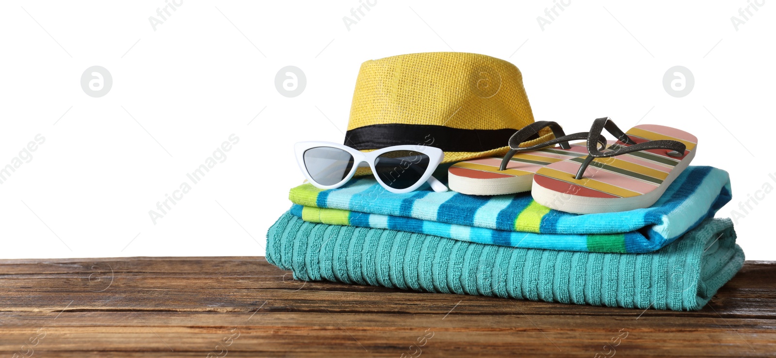 Photo of Composition with different beach objects on wooden table, white background