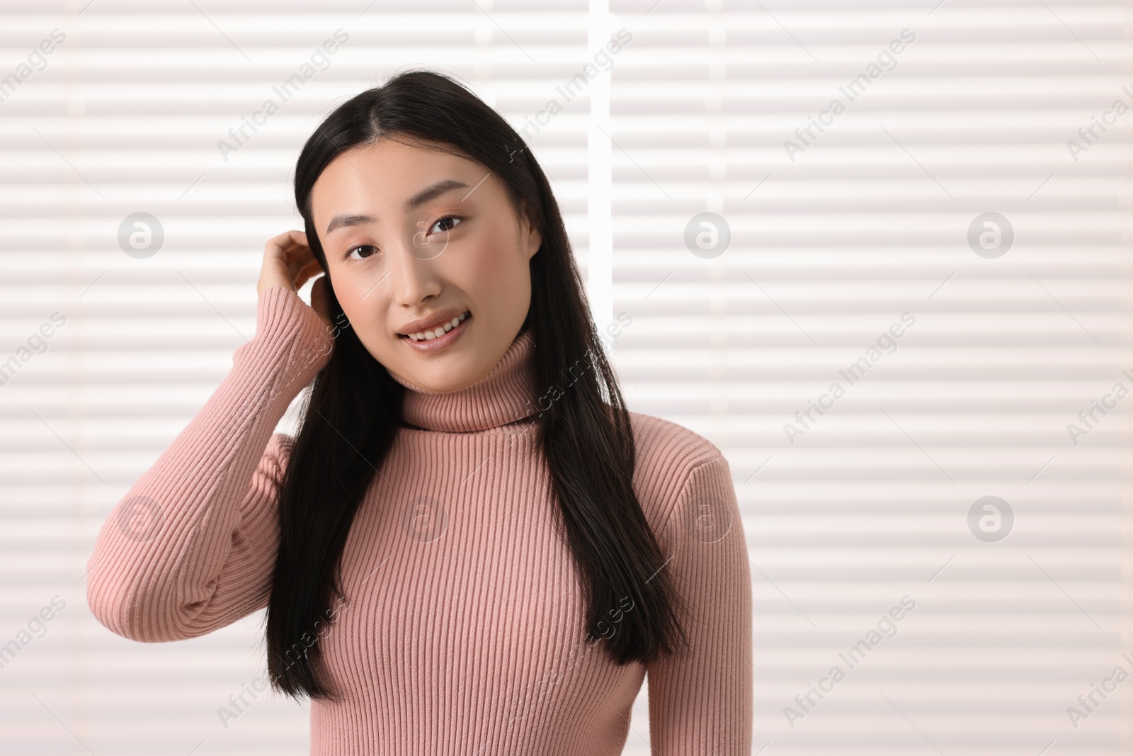 Photo of Portrait of smiling businesswoman in office. Space for text