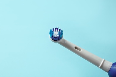 Electric toothbrush on color background. Dental care