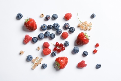 Photo of Raspberries and different berries on white background