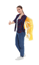 Photo of Young woman holding hanger with jacket on white background. Dry-cleaning service