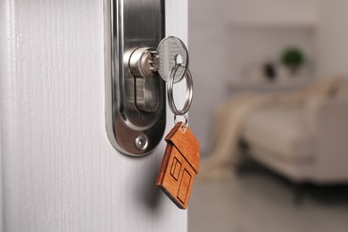 Photo of Closeup view of door with key open into room. Space for text