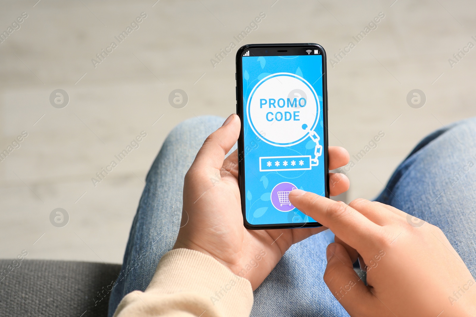 Photo of Man activating promo code on smartphone, closeup