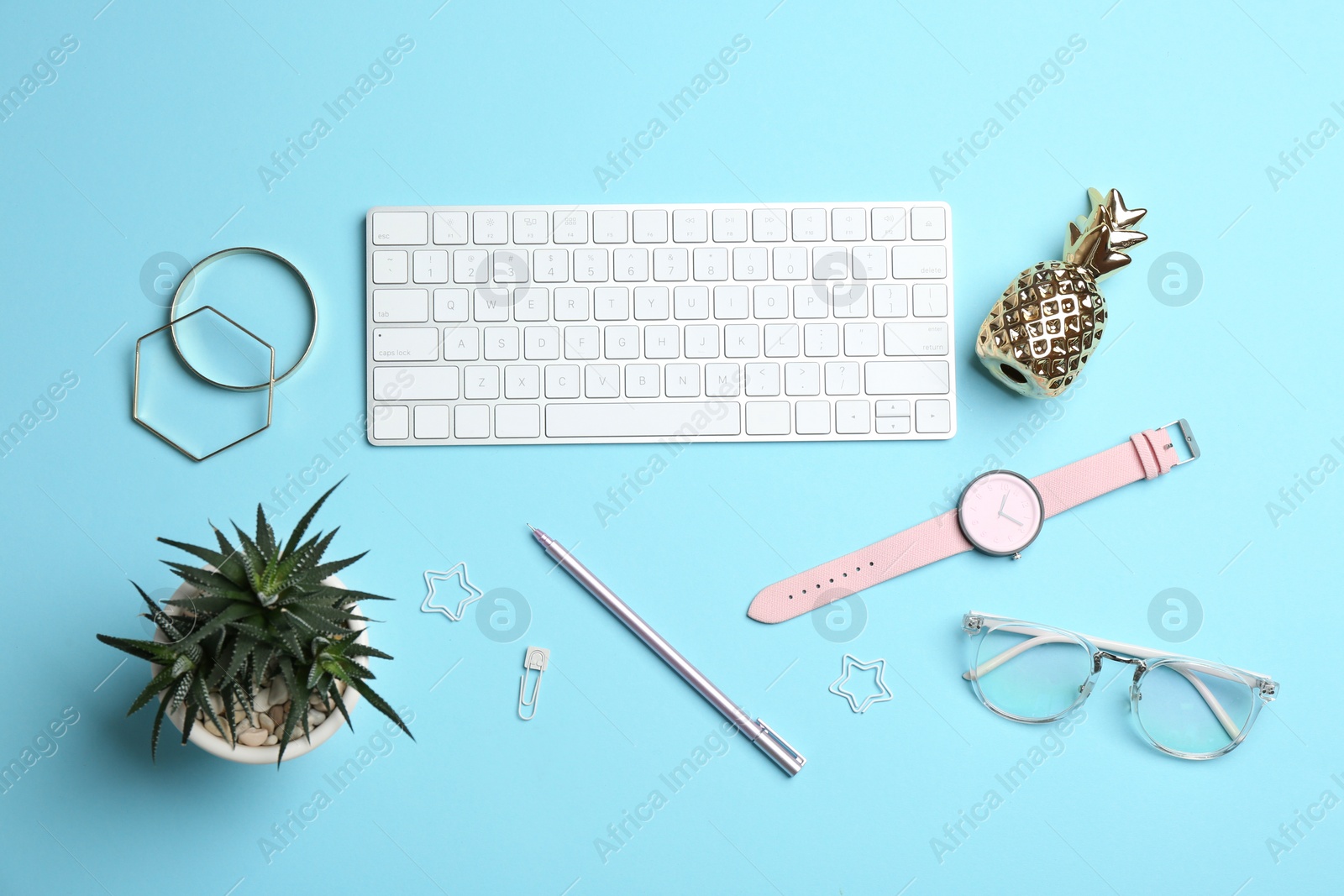 Photo of Blogger's workplace with keyboard and accessories on color background, top view