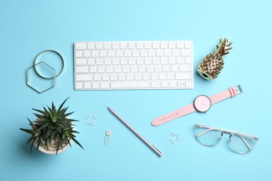 Photo of Blogger's workplace with keyboard and accessories on color background, top view
