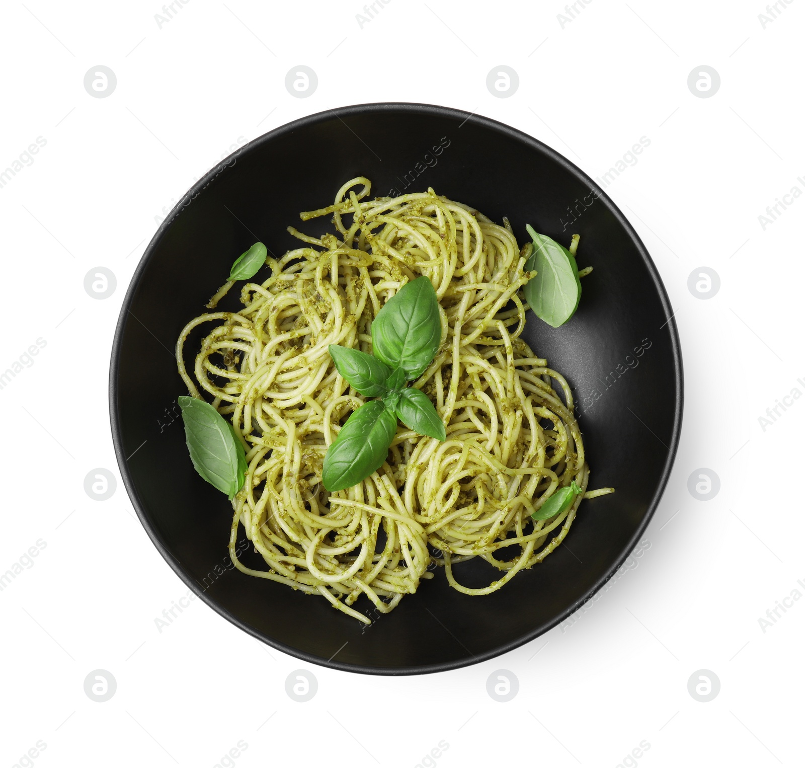 Photo of Bowl of delicious pasta with pesto sauce and basil isolated on white, top view