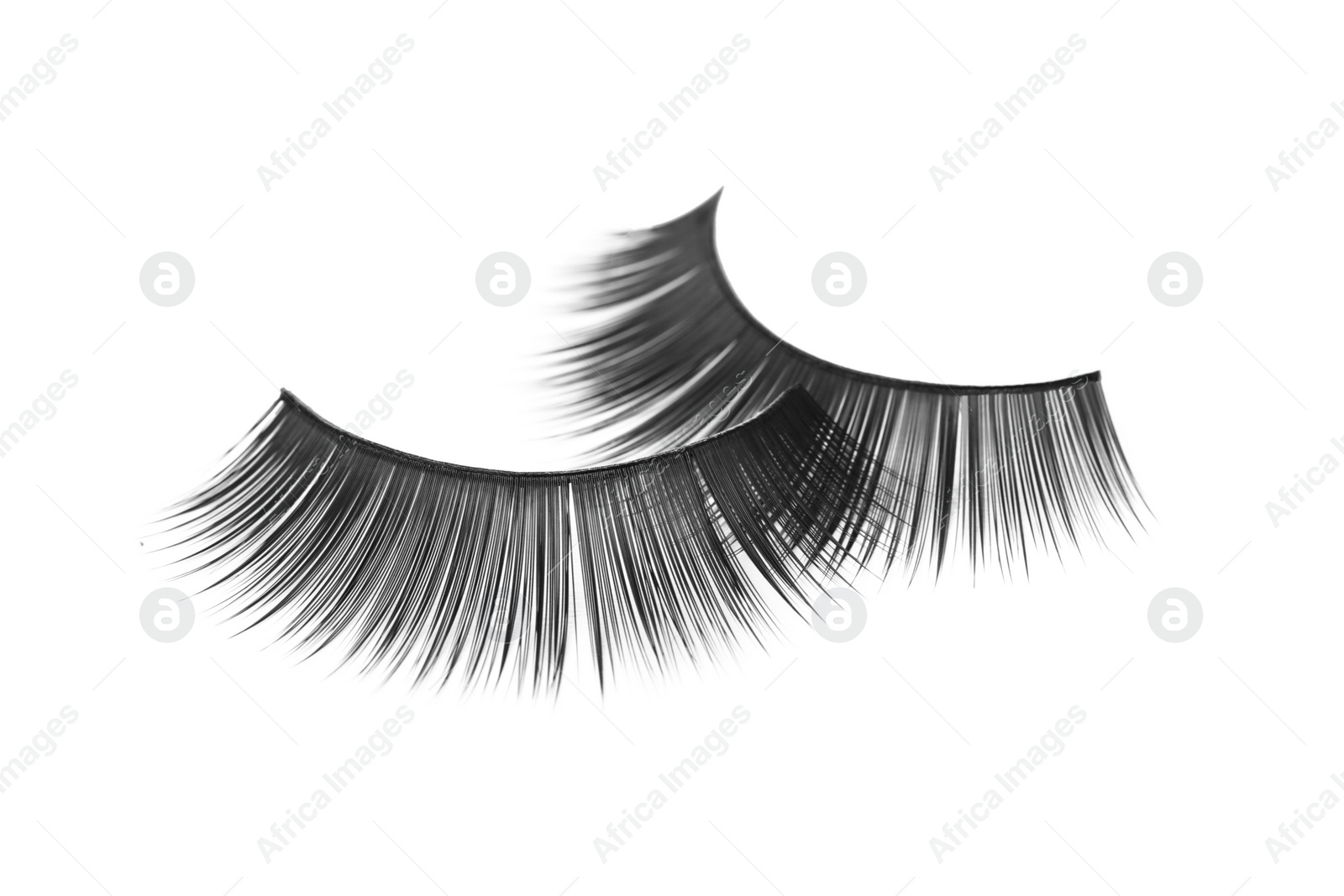 Photo of Fake eyelashes on white background. Makeup product