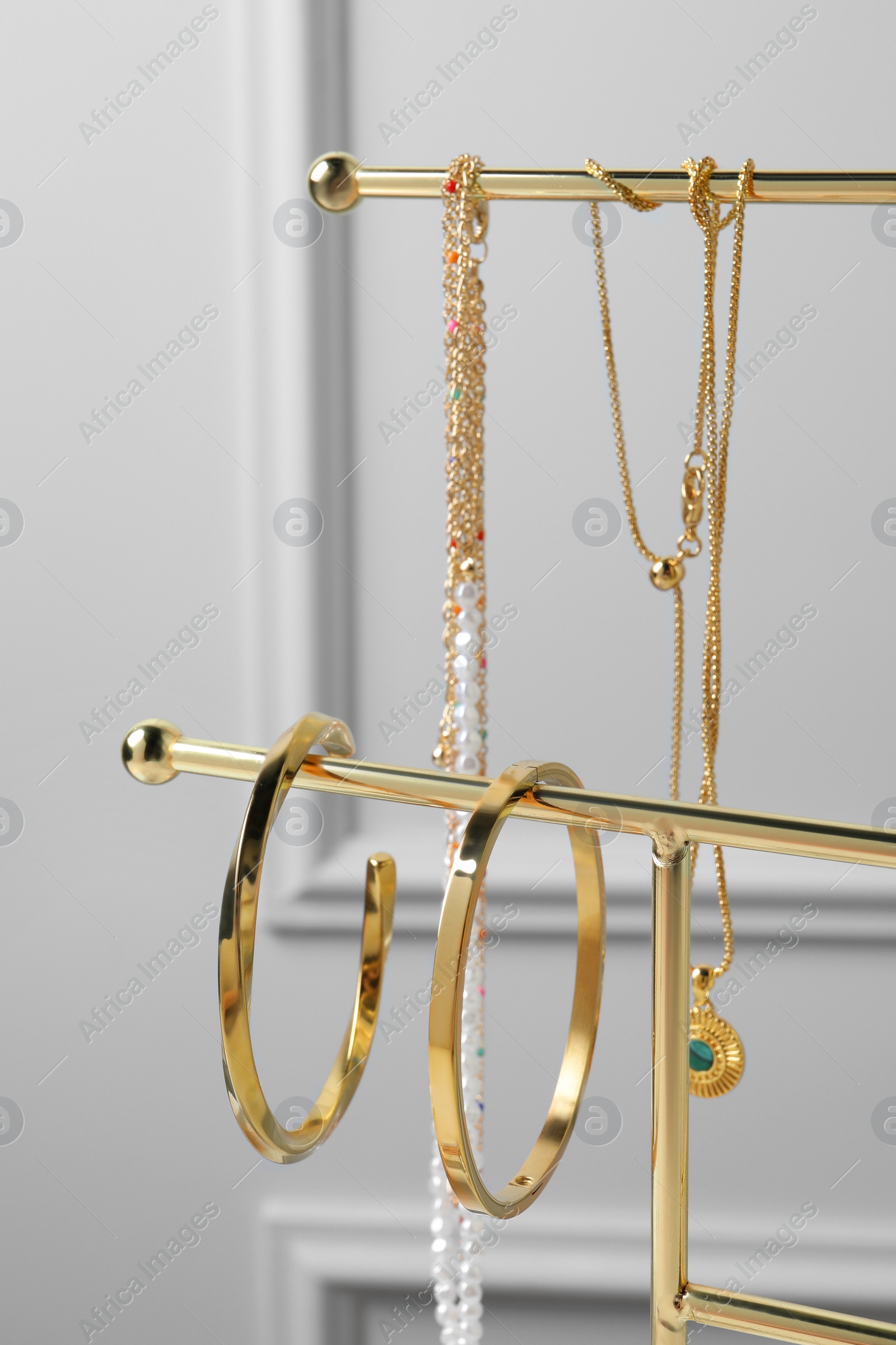 Photo of Holder with set of beautiful bijouterie, closeup