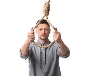 Photo of Depressed man with rope noose on white background