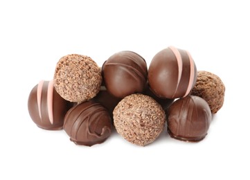 Photo of Many different delicious chocolate truffles on white background