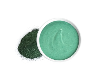 Freshly made spirulina facial mask in bowl and powder on white background, top view