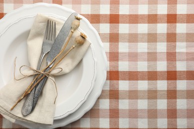 Stylish setting with cutlery and plates on table, top view. Space for text