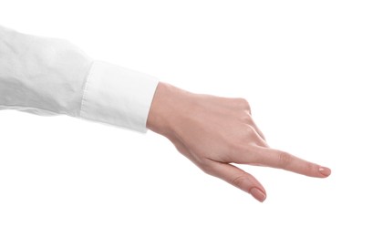 Woman pointing with index finger on white background, closeup